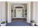 Elegant front door entrance featuring decorative sidelights and transom window, complemented by classic architectural details at 3447 Washington Blvd, Indianapolis, IN 46205