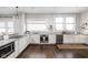 Modern kitchen featuring white cabinets, stainless steel appliances, and granite countertops at 3447 Washington Blvd, Indianapolis, IN 46205