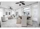 Bright living space with a sitting and dining area, featuring neutral furnishings and large windows at 3447 Washington Blvd, Indianapolis, IN 46205