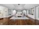 Spacious main bedroom showcases built-in shelving and arched details with hardwood floors at 3447 Washington Blvd, Indianapolis, IN 46205