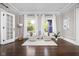 Bright sitting area with hardwood floors, large windows, and neutral color palette at 3447 Washington Blvd, Indianapolis, IN 46205