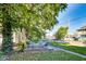 Relaxing backyard space with a charming deck featuring outdoor seating beneath the shade of mature trees at 3470 N Kenwood Ave, Indianapolis, IN 46208