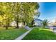 Spacious backyard with mature trees and lawn providing an ideal setting for outdoor activities and relaxation at 3470 N Kenwood Ave, Indianapolis, IN 46208