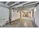 Unfinished basement featuring concrete floor and white painted walls and ceiling, with some storage items at 3470 N Kenwood Ave, Indianapolis, IN 46208