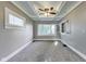 Bedroom featuring a coffered ceiling, neutral-toned carpet, and a large window at 3470 N Kenwood Ave, Indianapolis, IN 46208