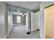 Gray bedroom with carpeted floor and white door to the closet, offering neutral and inviting space at 3470 N Kenwood Ave, Indianapolis, IN 46208