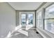 Neutral bedroom featuring gray walls, gray carpet and three windows providing ample natural light at 3470 N Kenwood Ave, Indianapolis, IN 46208