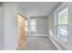 Bright bedroom features neutral gray walls, gray carpet, and a closet with mirrored sliding doors at 3470 N Kenwood Ave, Indianapolis, IN 46208