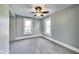 Spacious bedroom with two windows that let in natural light, walls are neutral colored at 3470 N Kenwood Ave, Indianapolis, IN 46208