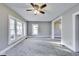 Spacious living room with large windows and neutral-toned carpet at 3470 N Kenwood Ave, Indianapolis, IN 46208