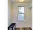 Mud room boasts white cabinets and walls for a bright, clean feel at 3470 N Kenwood Ave, Indianapolis, IN 46208