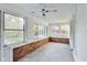 Bright sunroom with brick accents, large windows, and ceiling fan at 3470 N Kenwood Ave, Indianapolis, IN 46208