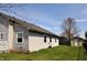 View of home exterior with large backyard and storage shed, and side of house at 3513 Berkdale Dr, Columbus, IN 47203