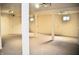 Spacious unfinished basement area with carpet, support beams, and lighting at 3513 Berkdale Dr, Columbus, IN 47203