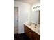 A traditional bathroom with a double vanity, large mirror, and ample lighting fixtures at 3513 Berkdale Dr, Columbus, IN 47203