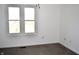 Bedroom with carpet, white walls, and a window view at 3513 Berkdale Dr, Columbus, IN 47203