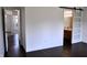 Open view of the bedroom showing the sliding door to the bath and access to other rooms at 3513 Berkdale Dr, Columbus, IN 47203