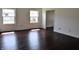 Bright bedroom features beautiful windows with lots of natural light, freshly painted white walls, and hardwood floors at 3513 Berkdale Dr, Columbus, IN 47203