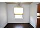 This dining room is lit by a modern chandelier and features a window at 3513 Berkdale Dr, Columbus, IN 47203