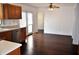 This kitchen and dining space has a wood floor and light countertops at 3513 Berkdale Dr, Columbus, IN 47203
