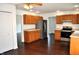 The kitchen is equipped with stainless steel appliances, light countertops and wood cabinets at 3513 Berkdale Dr, Columbus, IN 47203