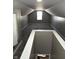 Finished attic space with neutral walls, carpet, and a window for natural light at 3521 N Rural St, Indianapolis, IN 46218