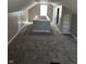 Finished attic space with neutral walls, carpet, and a window for natural light at 3521 N Rural St, Indianapolis, IN 46218