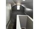 Finished attic space with neutral walls, carpet, and a window for natural light at 3521 N Rural St, Indianapolis, IN 46218