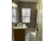 Modern bathroom with a black faucet, white vessel sink, and new tile flooring at 3521 N Rural St, Indianapolis, IN 46218