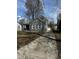 Charming single-Gathering home with a well-maintained front yard and a long concrete driveway leading to a detached garage at 3521 N Rural St, Indianapolis, IN 46218