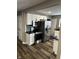 Modern kitchen with stainless steel appliances, white cabinets, and stylish backsplash at 3521 N Rural St, Indianapolis, IN 46218