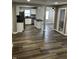 Spacious living room with hardwood floors that transition into an open kitchen at 3521 N Rural St, Indianapolis, IN 46218