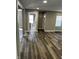 Open concept living room with wood floors, neutral walls, and natural light at 3521 N Rural St, Indianapolis, IN 46218