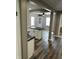 Open concept living area with kitchen island, wood floors, neutral walls, and natural light at 3521 N Rural St, Indianapolis, IN 46218
