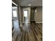 Open concept living room with wood floors, neutral walls, and natural light at 3521 N Rural St, Indianapolis, IN 46218