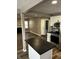 An open concept living room and kitchen featuring hardwood floors and stainless steel appliances at 3521 N Rural St, Indianapolis, IN 46218