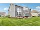 Expansive backyard featuring a well-manicured lawn and an inviting outdoor patio area for entertaining guests at 3645 Conifer Dr, Zionsville, IN 46077
