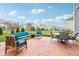 Serene backyard patio with comfortable outdoor furniture and a lush green lawn for relaxing and entertaining at 3645 Conifer Dr, Zionsville, IN 46077