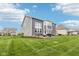 Spacious backyard with lush green lawn and a beautiful patio perfect for outdoor gatherings and relaxation at 3645 Conifer Dr, Zionsville, IN 46077