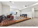Finished basement with a raised platform featuring a drum kit, piano, and musical equipment at 3645 Conifer Dr, Zionsville, IN 46077