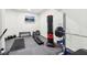 Basement gym with workout equipment, including a weight rack and punching bag, for fitness enthusiasts at 3645 Conifer Dr, Zionsville, IN 46077