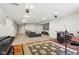 Finished basement with a sectional sofa, carpet, and a raised platform with musical instruments at 3645 Conifer Dr, Zionsville, IN 46077
