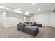Spacious finished basement with gray sectional sofa, carpet floors and recessed lighting at 3645 Conifer Dr, Zionsville, IN 46077