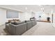 Finished basement with sectional sofa, movie screen, and raised platform with musical instruments at 3645 Conifer Dr, Zionsville, IN 46077