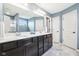 Spacious bathroom has dual sinks, a large mirror, and multiple access points at 3645 Conifer Dr, Zionsville, IN 46077