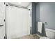 Well-lit bathroom featuring a shower with white shower curtain, tile floors, and neutral paint at 3645 Conifer Dr, Zionsville, IN 46077