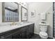 Modern bathroom featuring double mirrors and vanity with marble countertops for an elegant appeal at 3645 Conifer Dr, Zionsville, IN 46077