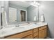 A bathroom featuring a double sink vanity with white countertop at 3645 Conifer Dr, Zionsville, IN 46077