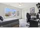 A bedroom with large window, ceiling fan, and modern gaming chair at 3645 Conifer Dr, Zionsville, IN 46077