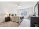A Primary bedroom with a ceiling fan, a large window, and neutral decor at 3645 Conifer Dr, Zionsville, IN 46077